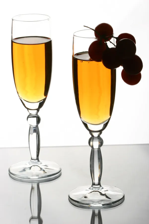 A wine glass on a kitchen counter in warm evening light, symbolizing everyday drinking habits